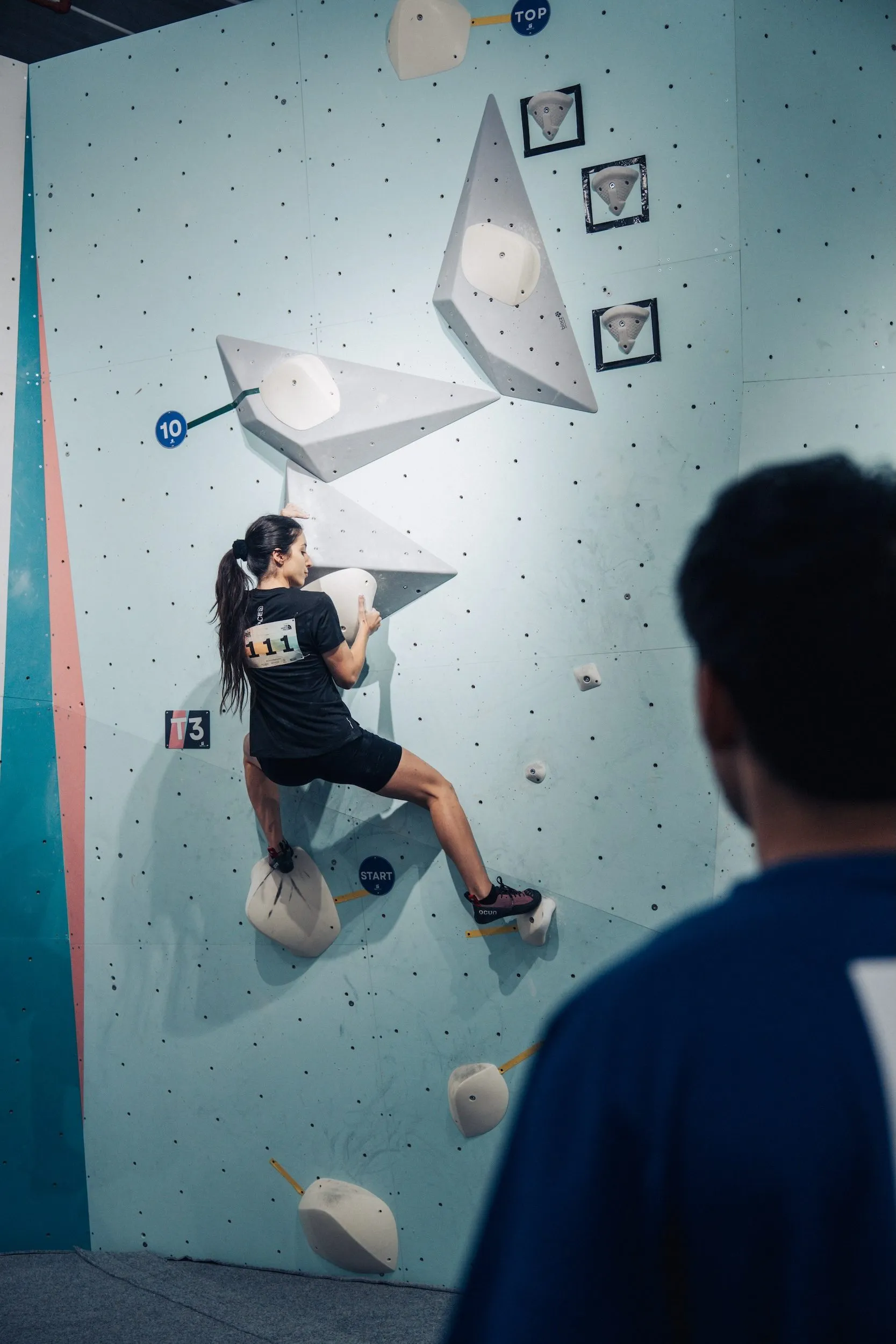 A Squad Games competitor climbing a route