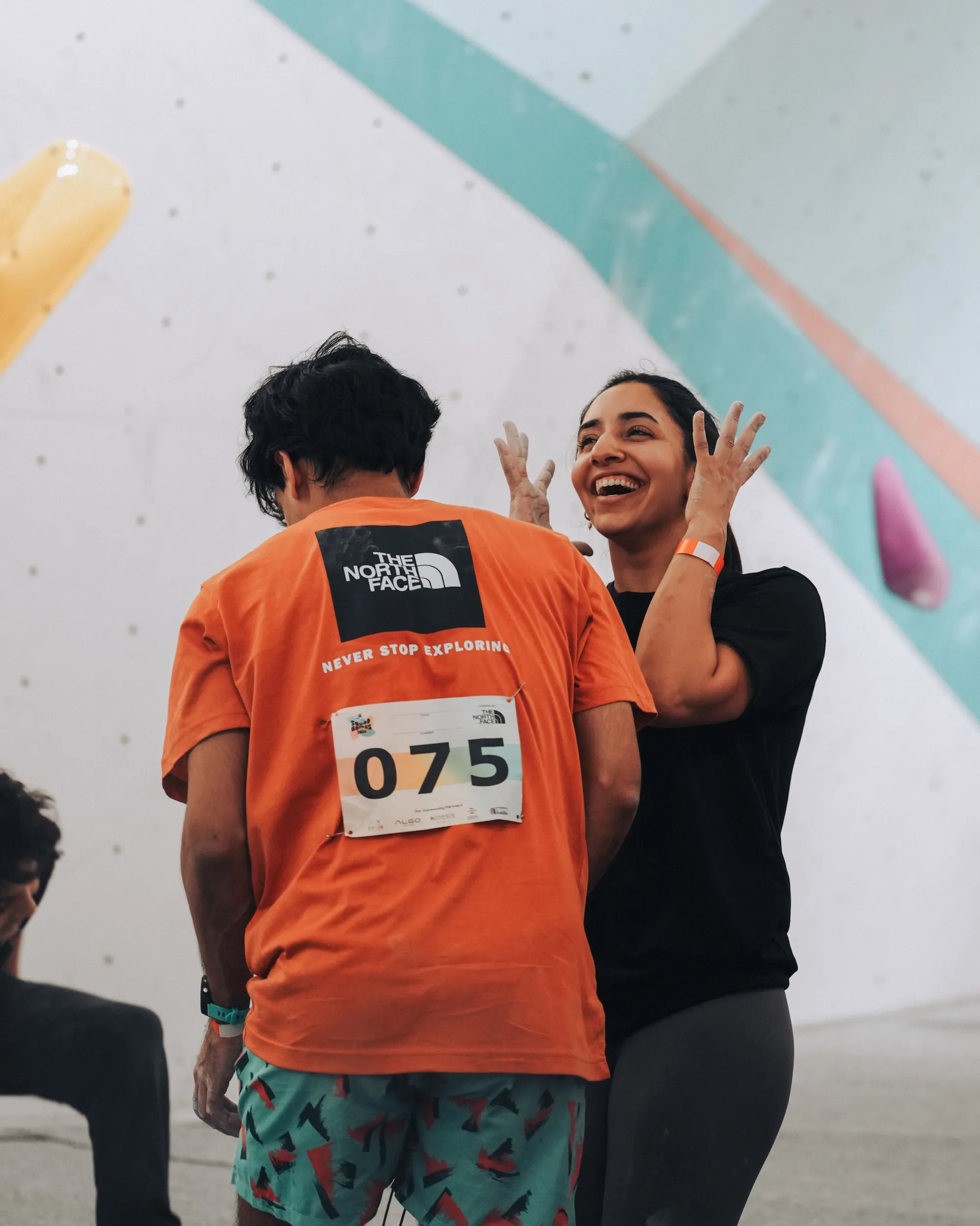 A joyful competitor at Squad Games team bouldering competition
