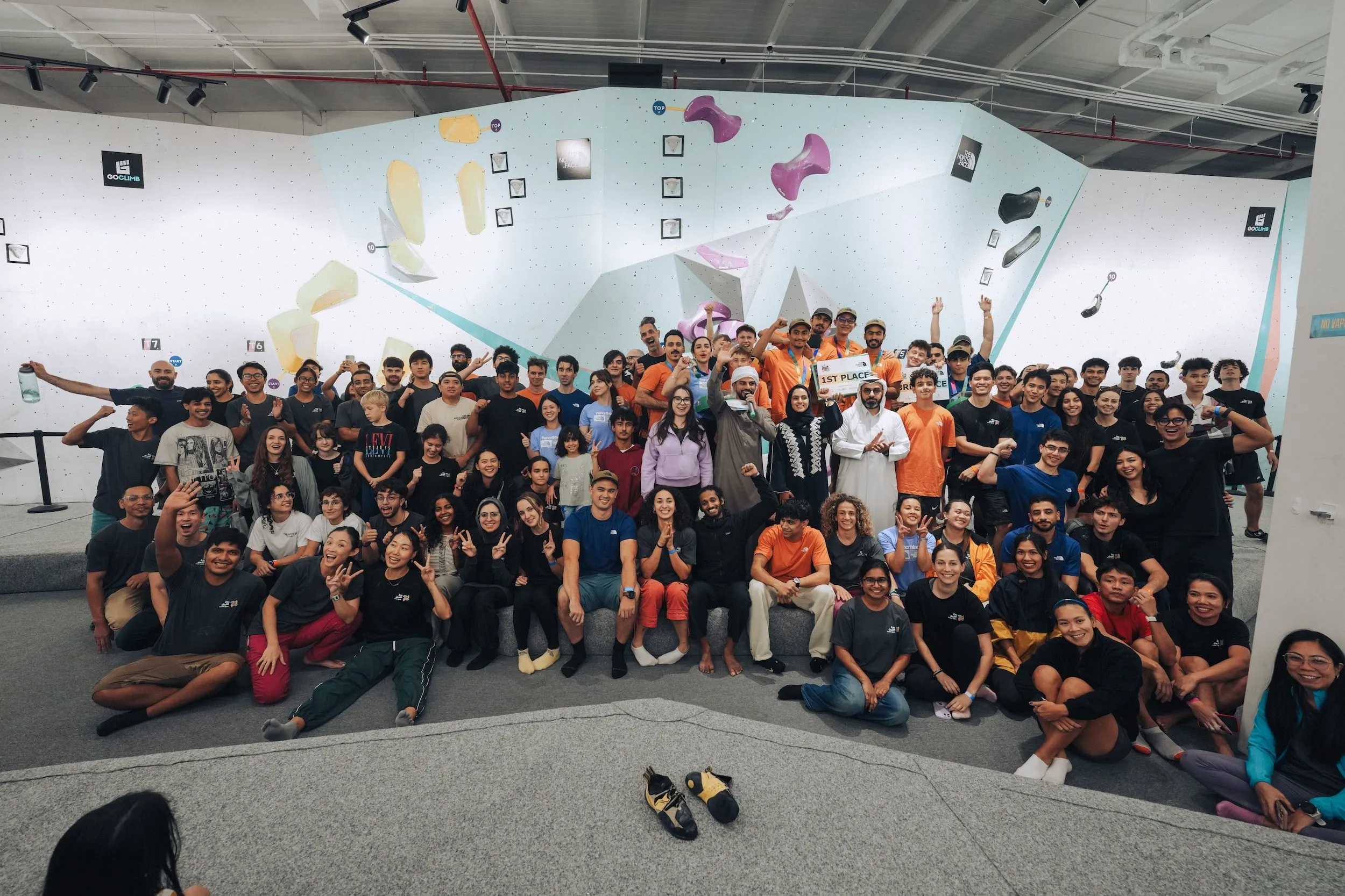 Climbers cheering during Squad Games team bouldering competition at GoClimb
