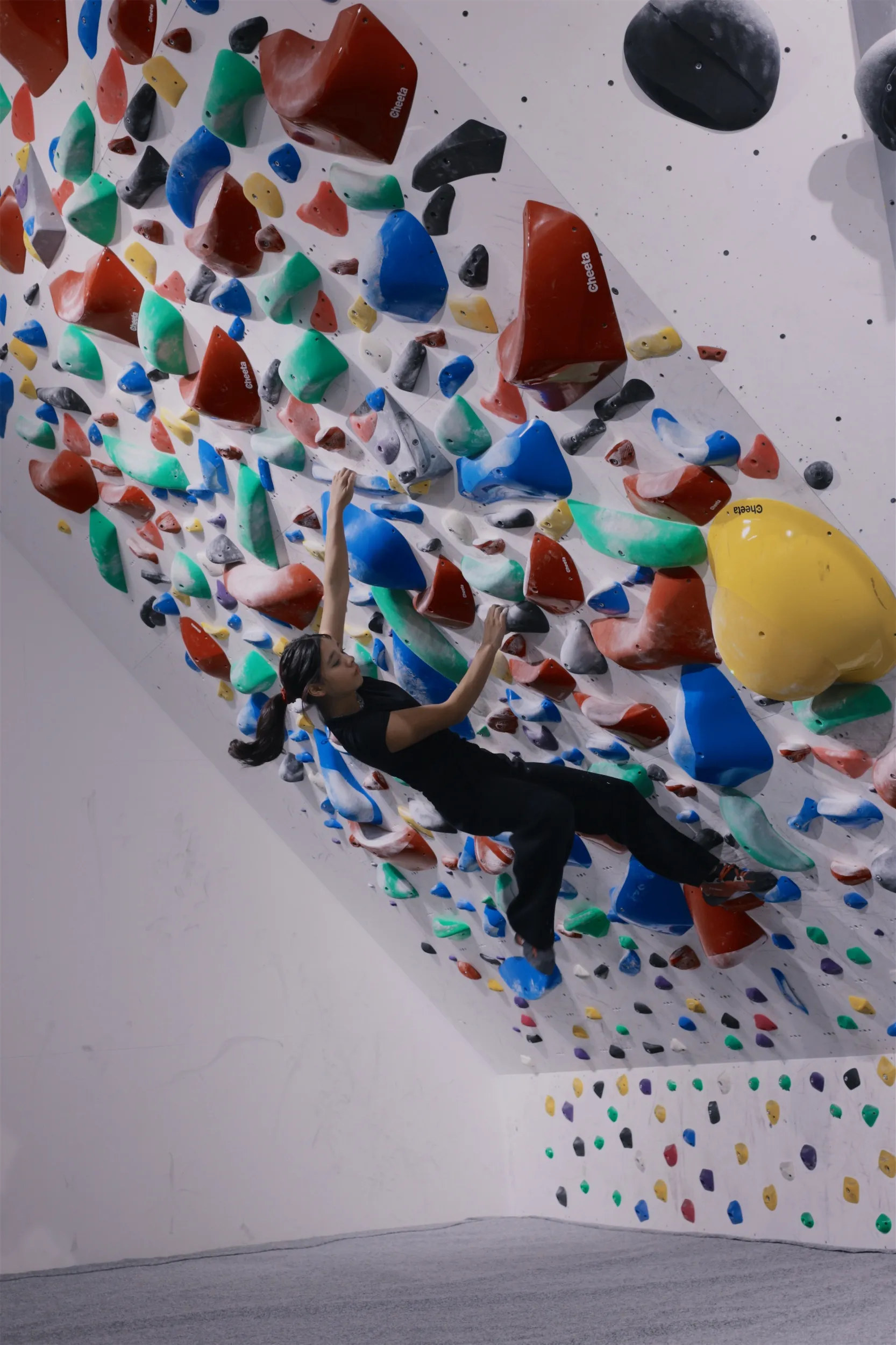 Climber on the spray wall during Sprayground competition at GoClimb