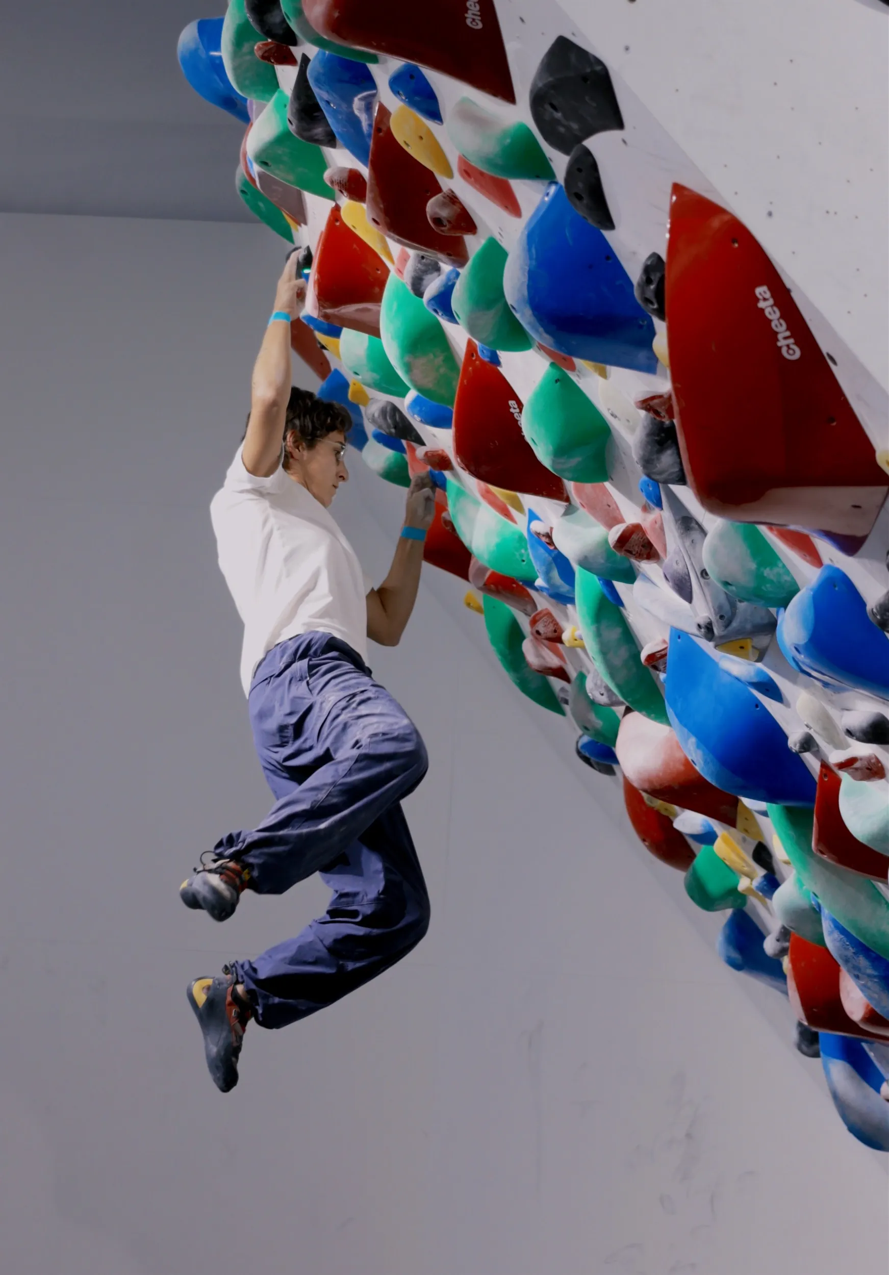 Climber on a spray wall at GoClimb during Sprayground '26