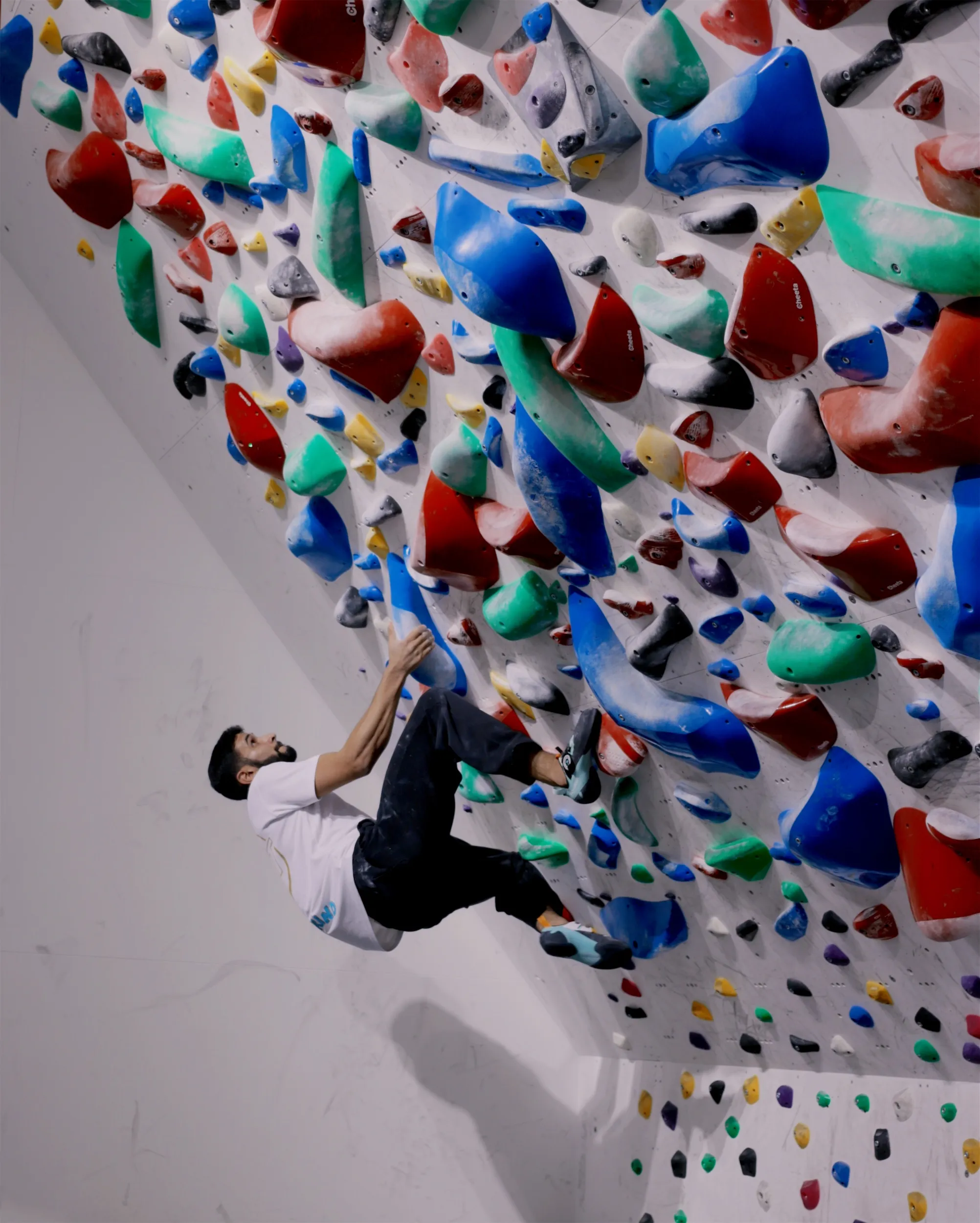 Climber on the spray wall during Sprayground competition at GoClimb