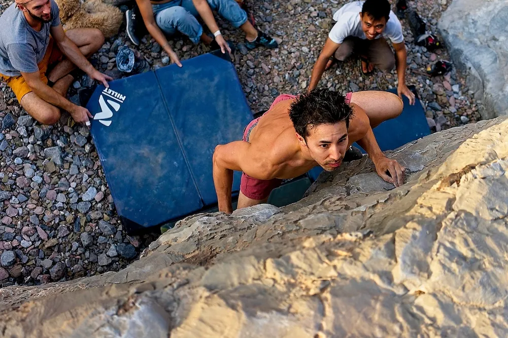 Brian cruising up a 6B boulder problem