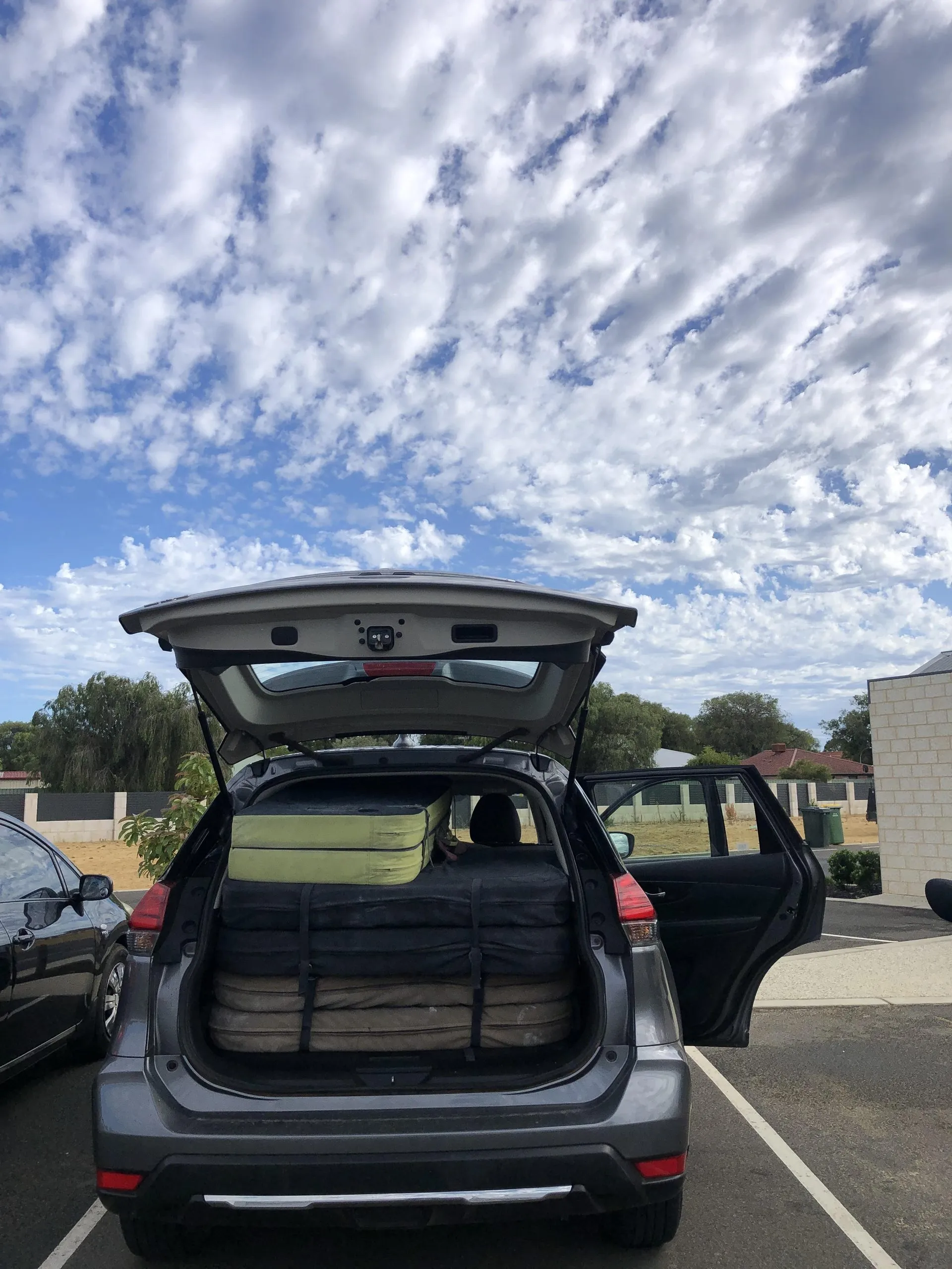 A tight fit for 4 boulder crash pads and 4 people in a Nissan X-Trail